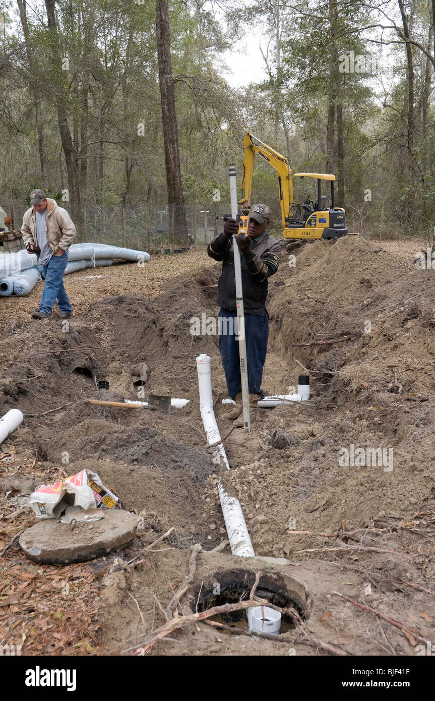 installing new septic system drainfield checking level angle for proper drainage Stock Photo