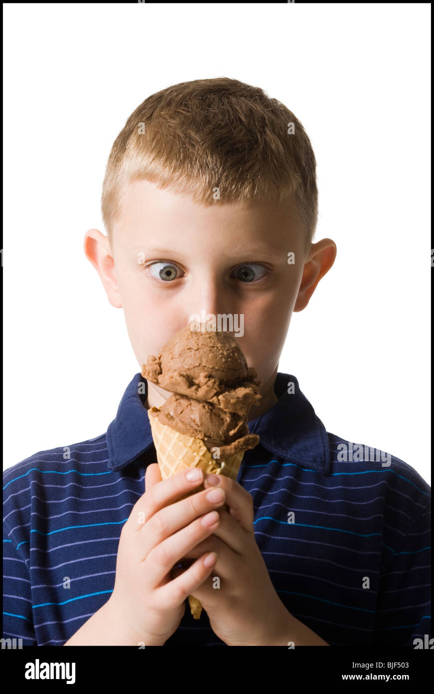 boy holding an ice cream cone Stock Photo Alamy
