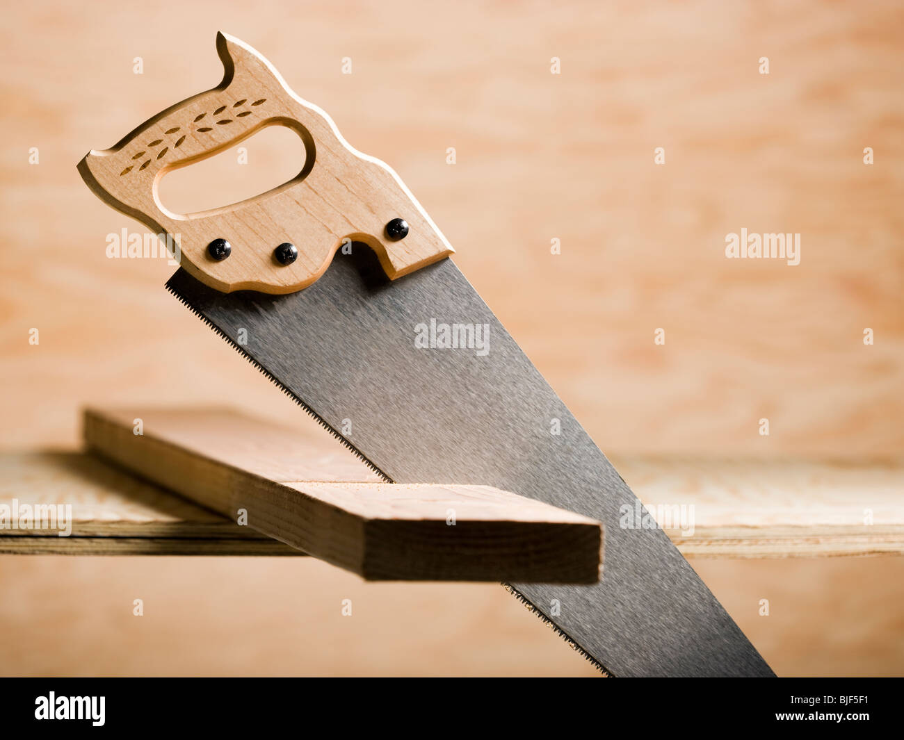 saw in a piece of wood Stock Photo