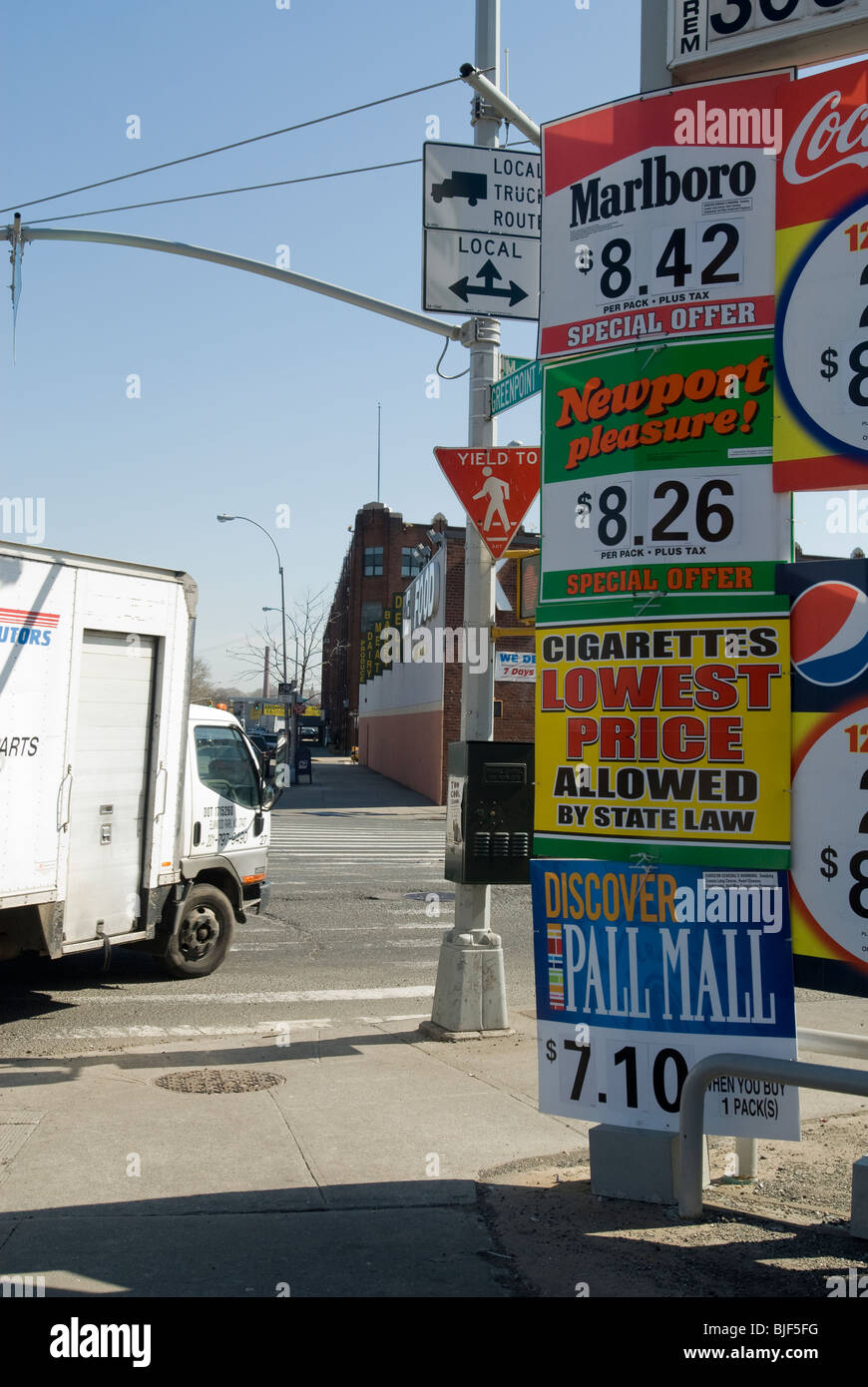 Advertising for cigarettes at a gas station in the Greenpoint neighborhood of Brooklyn Stock Photo