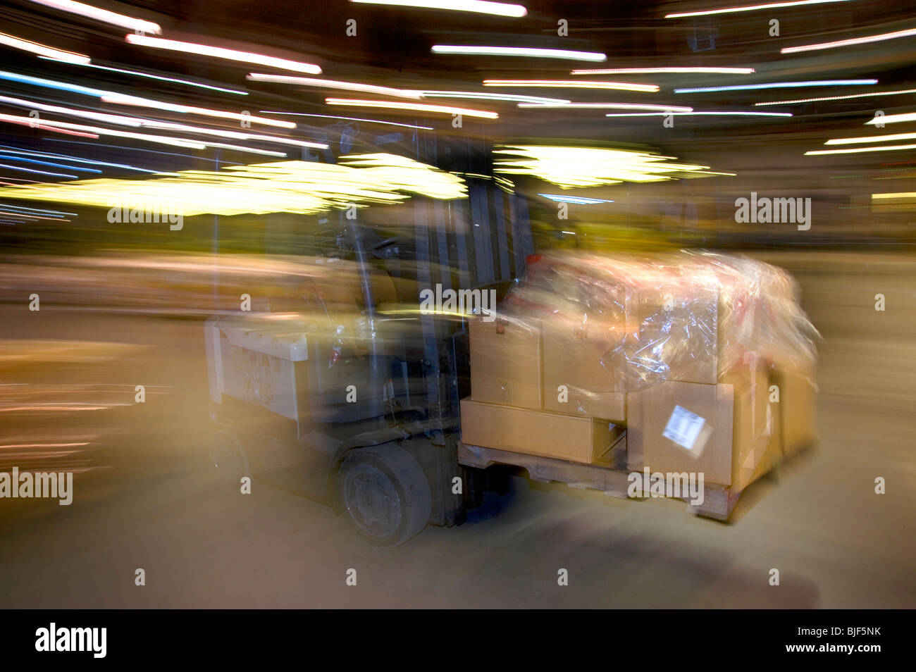 Action Photo of Warehouse Worker On Forklift Moving Boxes, Philadelphia, USA Stock Photo