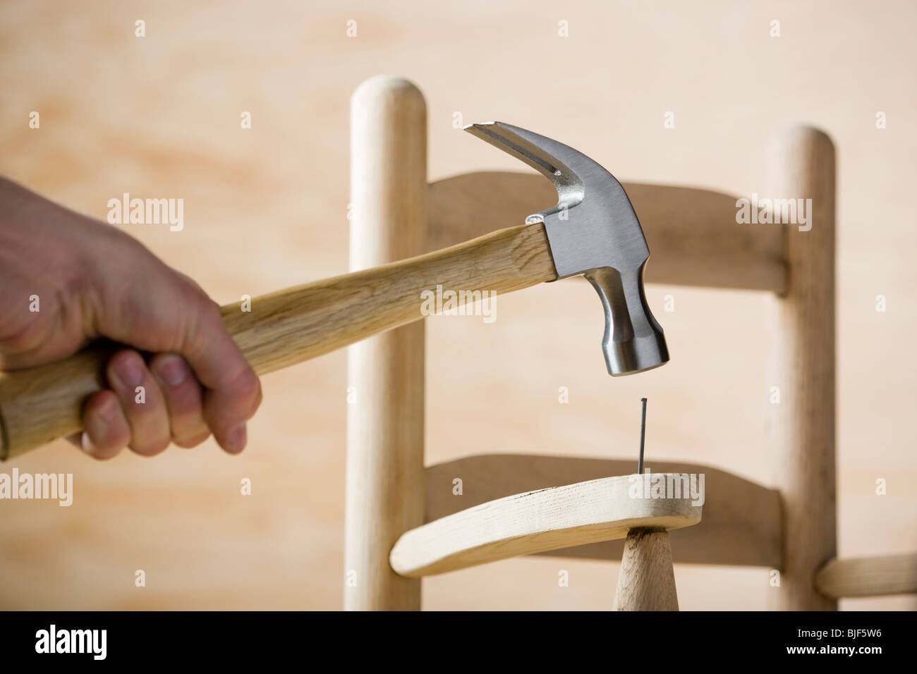 man making a chair Stock Photo