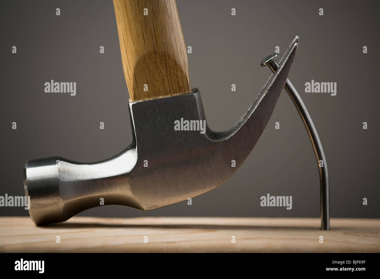 hammer pulling out a nail Stock Photo