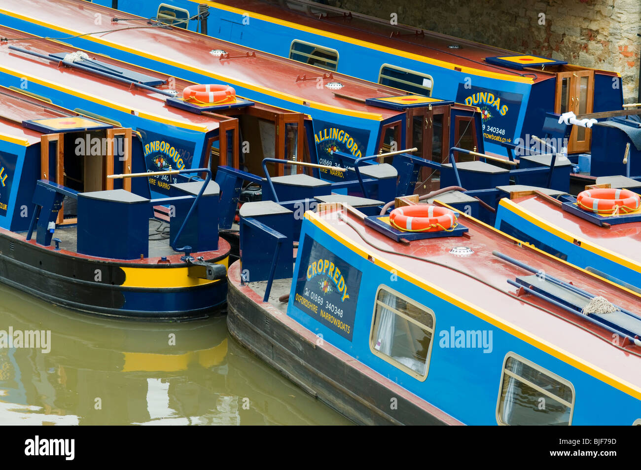 Narrowboats being prepared for hire at Heyford wharf on the Oxford canal Stock Photo