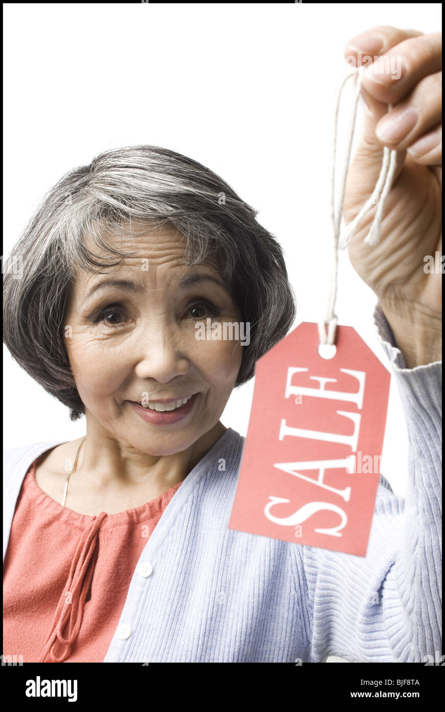 woman holding "sale" tag Stock Photo