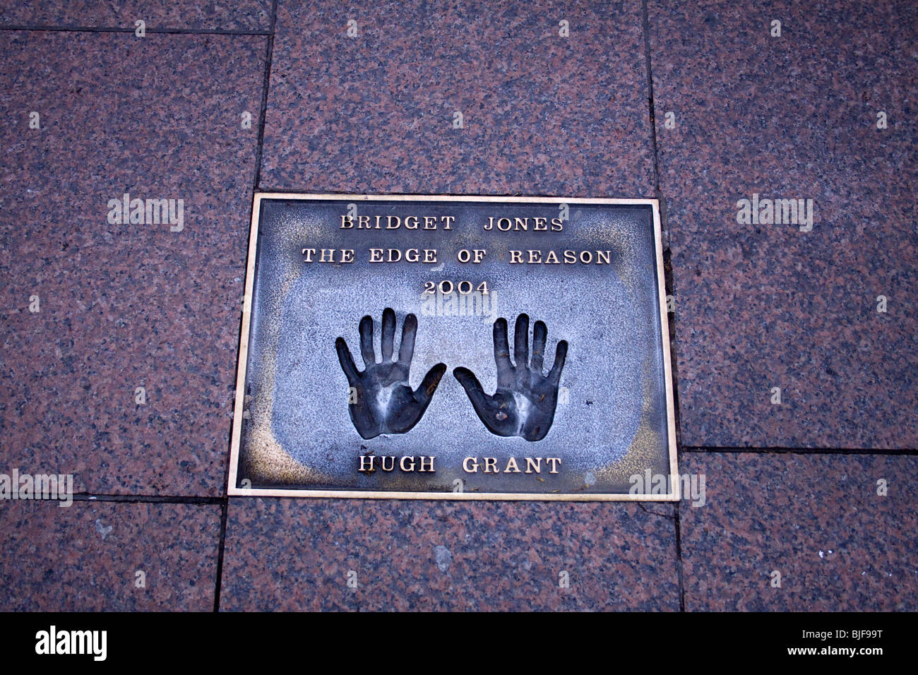 Film stars bronze hand prints in Leicester Square, London, UK Stock Photo