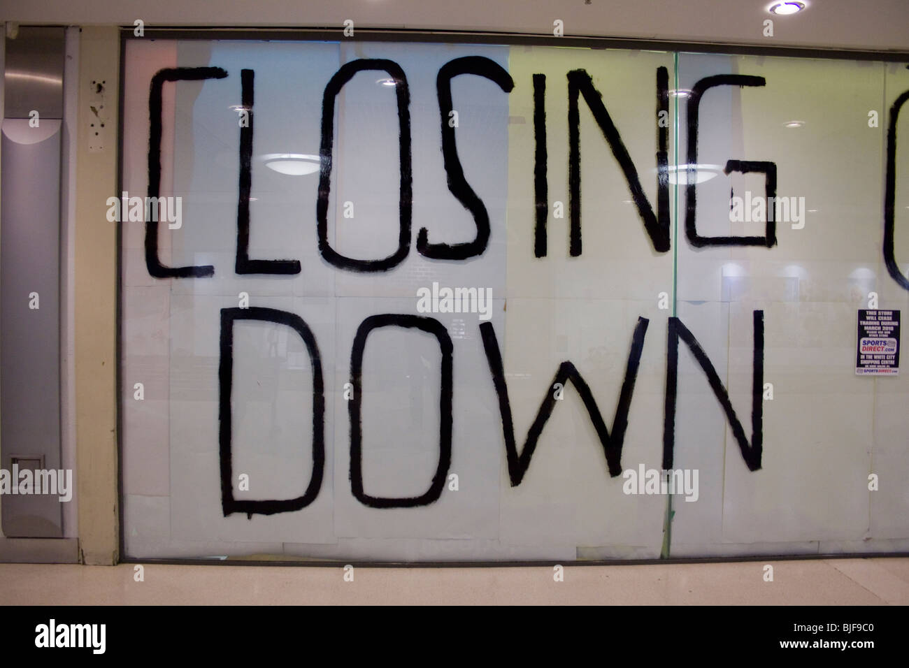 Closing Down written in big letters on a shop window Stock Photo