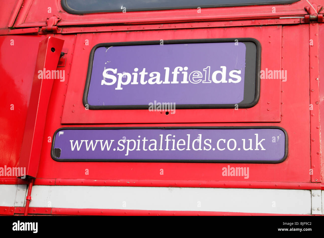 London red bus with Spitalfields sign on it, London Stock Photo