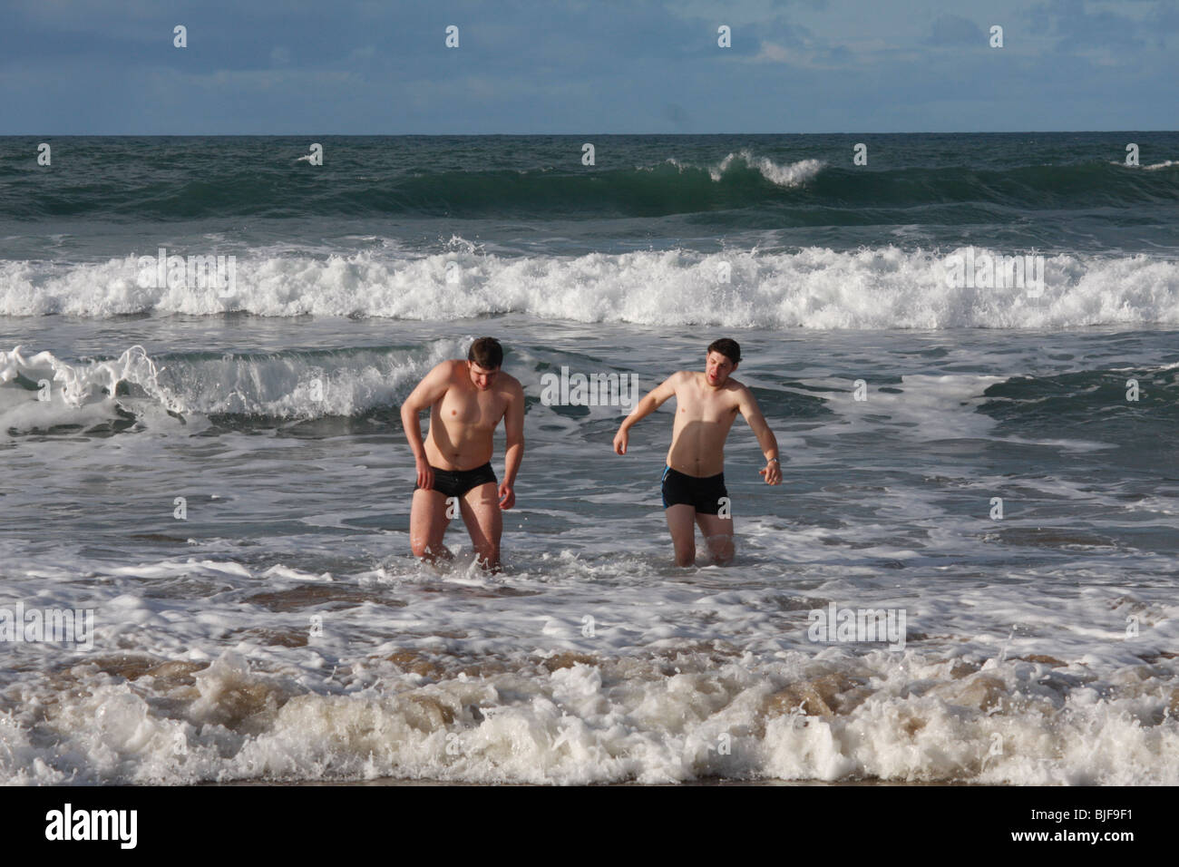 Swimmers on Christmas Day Swim at Crooklets Beach, Bude, Cornwall. Stock Photo