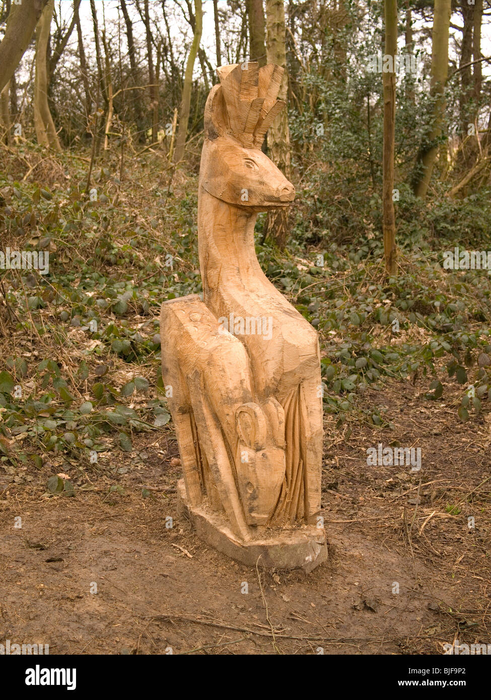 Wood sculpture of a deer and fawn by local chainsaw sculptor Steve