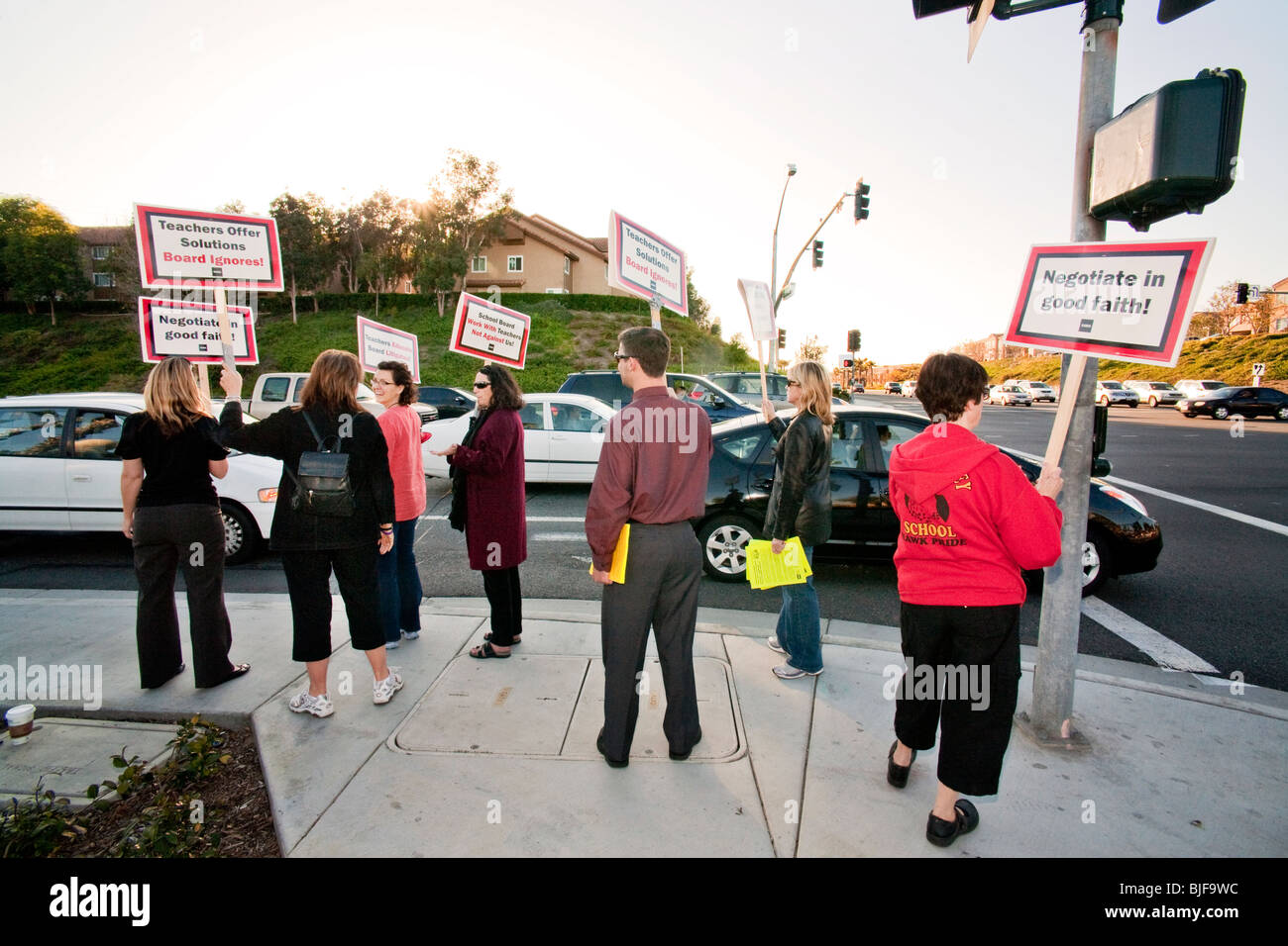Teachers stage a street corner picket against a threatened pay cut by the city school board Mission Viejo, California. Stock Photo
