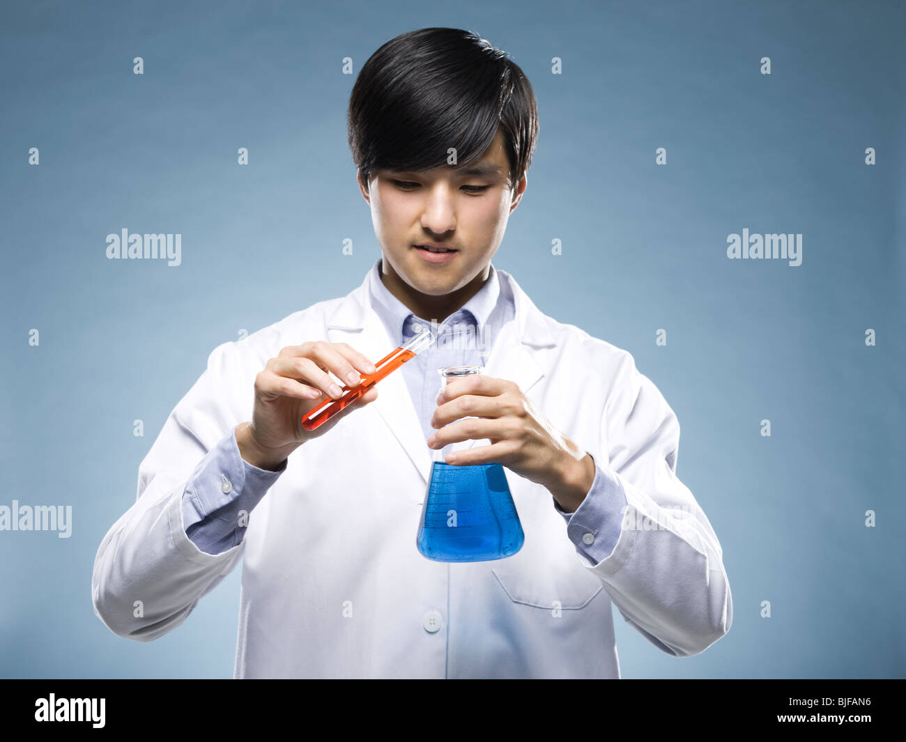 scientist holding test tubes Stock Photo