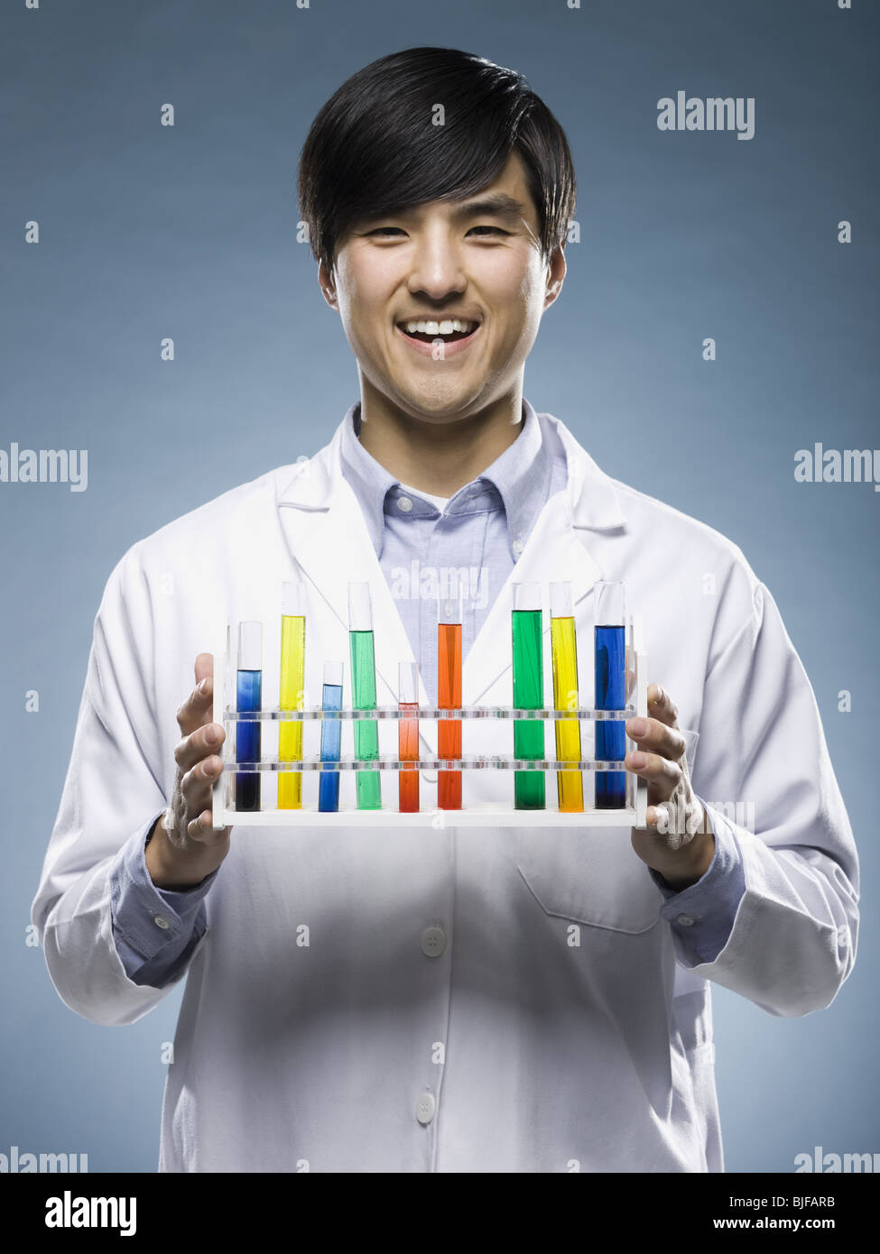 scientist holding test tubes Stock Photo