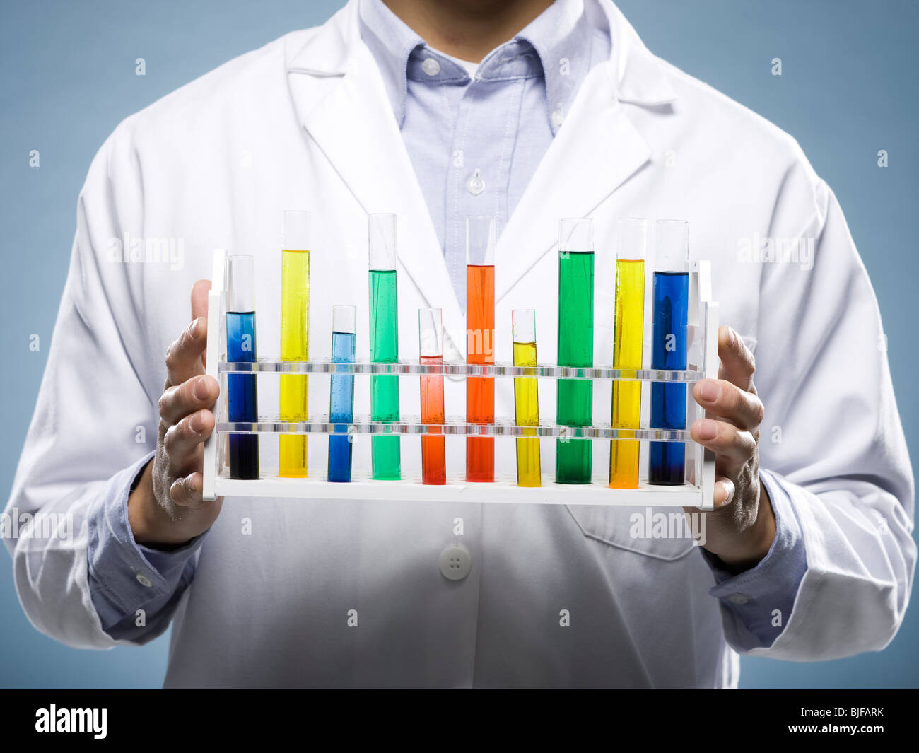 scientist holding test tubes Stock Photo