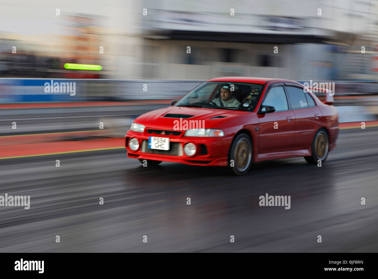 Racing Mitsubishi Evolution at Santa pod. Stock Photo