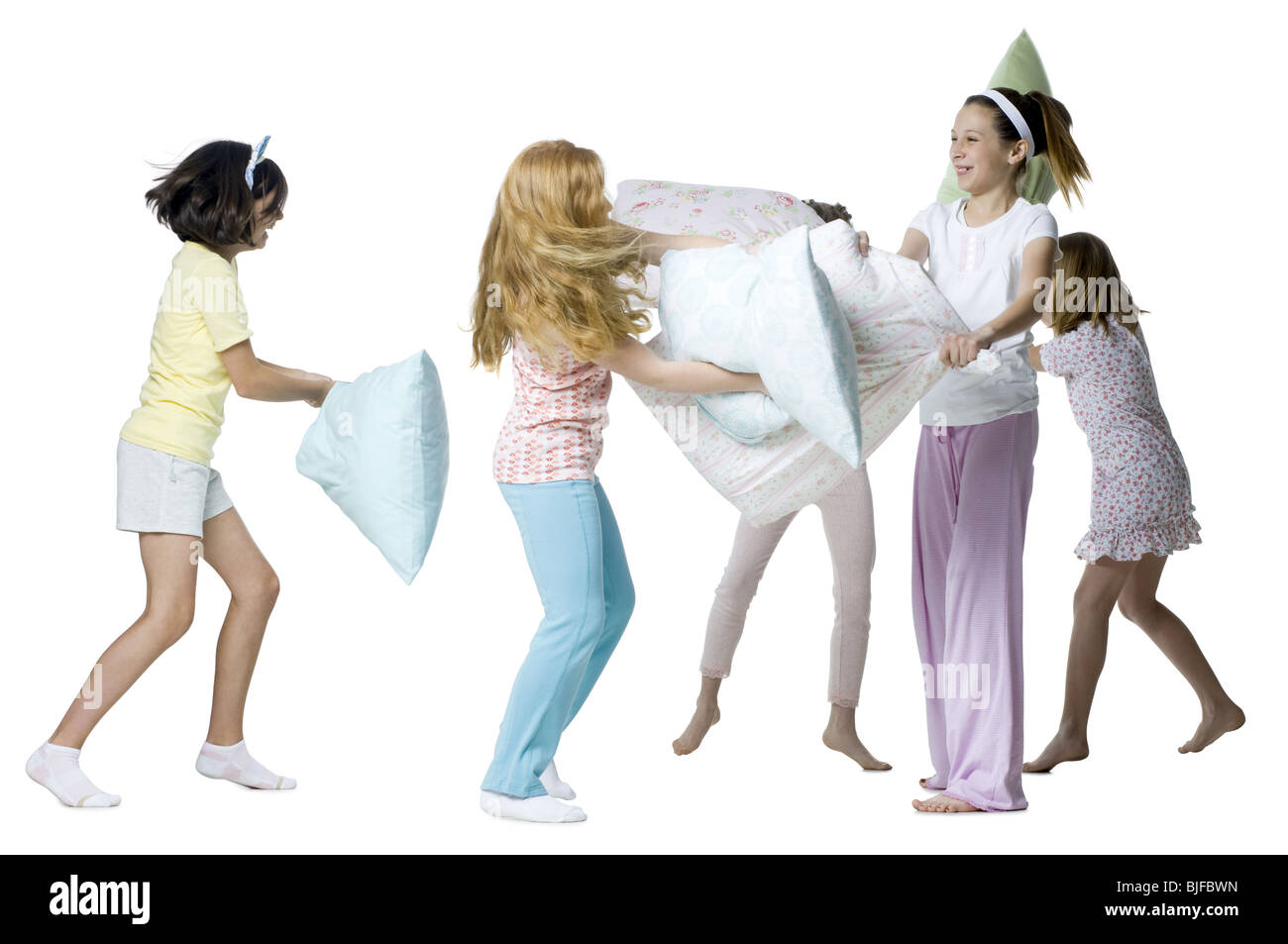 girls having a pillow fight Stock Photo
