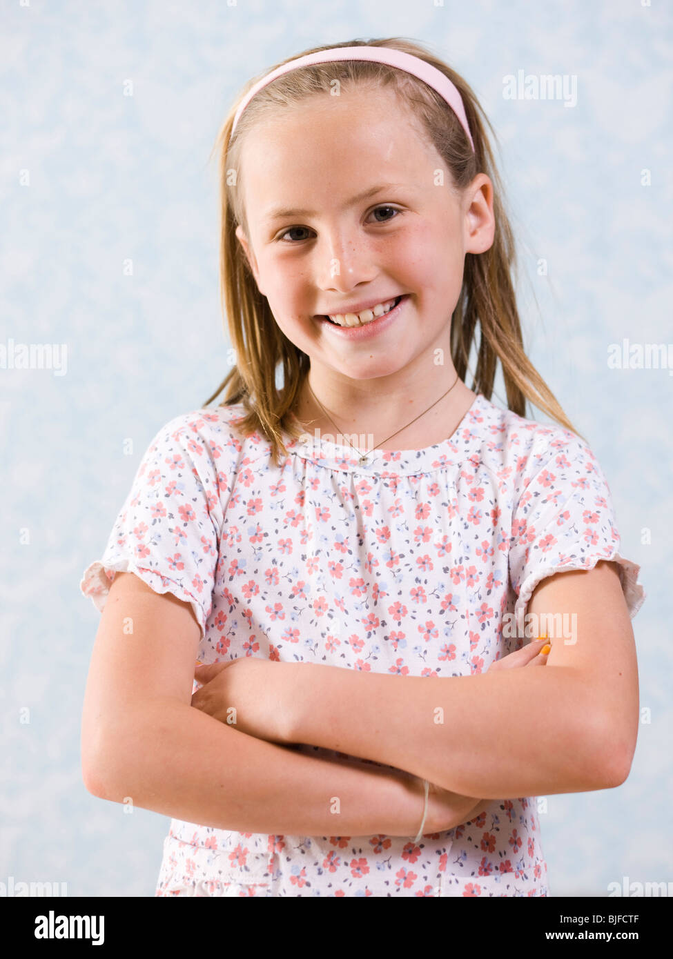 girl with arms folded Stock Photo - Alamy