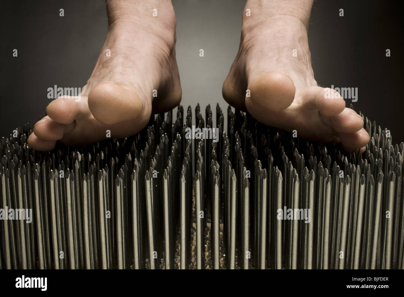 foot walking on nails Stock Photo - Alamy