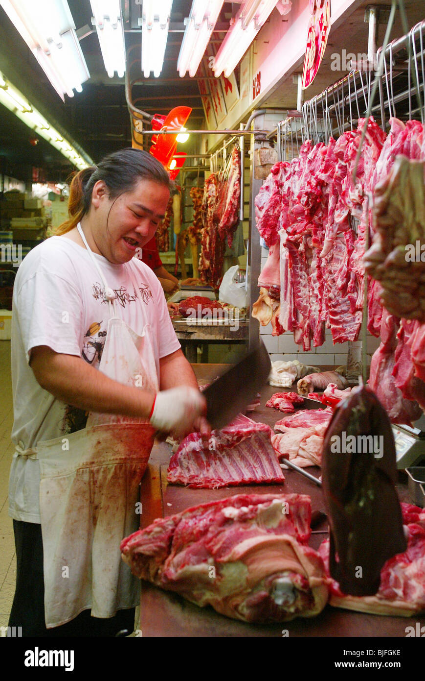 Butcher at work, Hong Kong, China Stock Photo