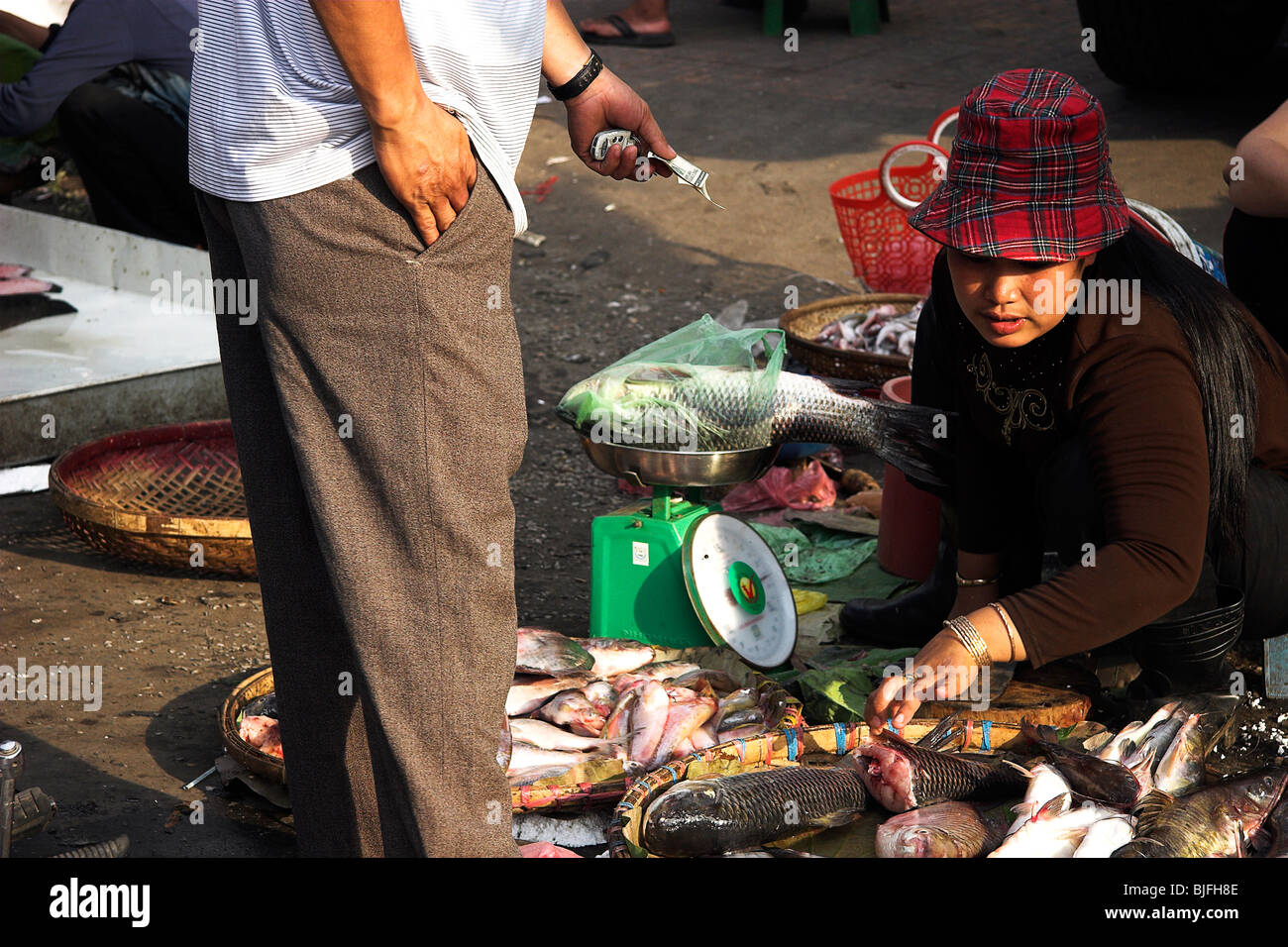 Fish monger on the streets of Phnom Penh, Cambodia Stock Photo