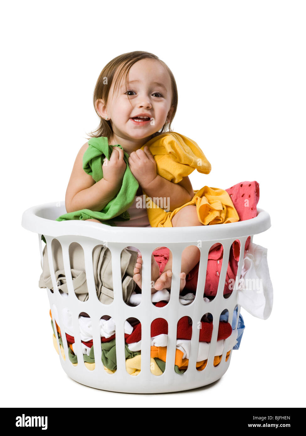 baby girl in a laundry basket Stock Photo Alamy
