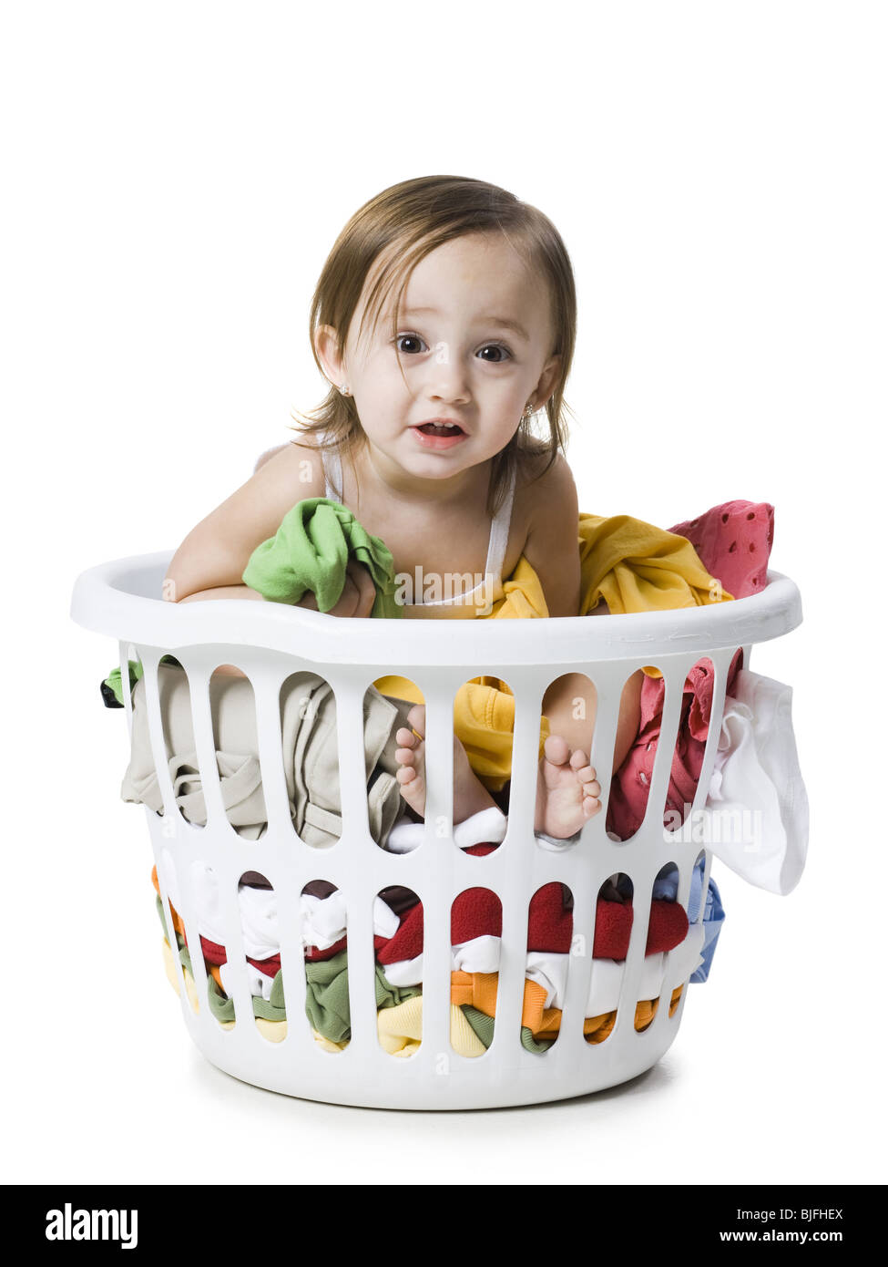 Baby girl sitting in basket Cut Out Stock Images & Pictures Alamy