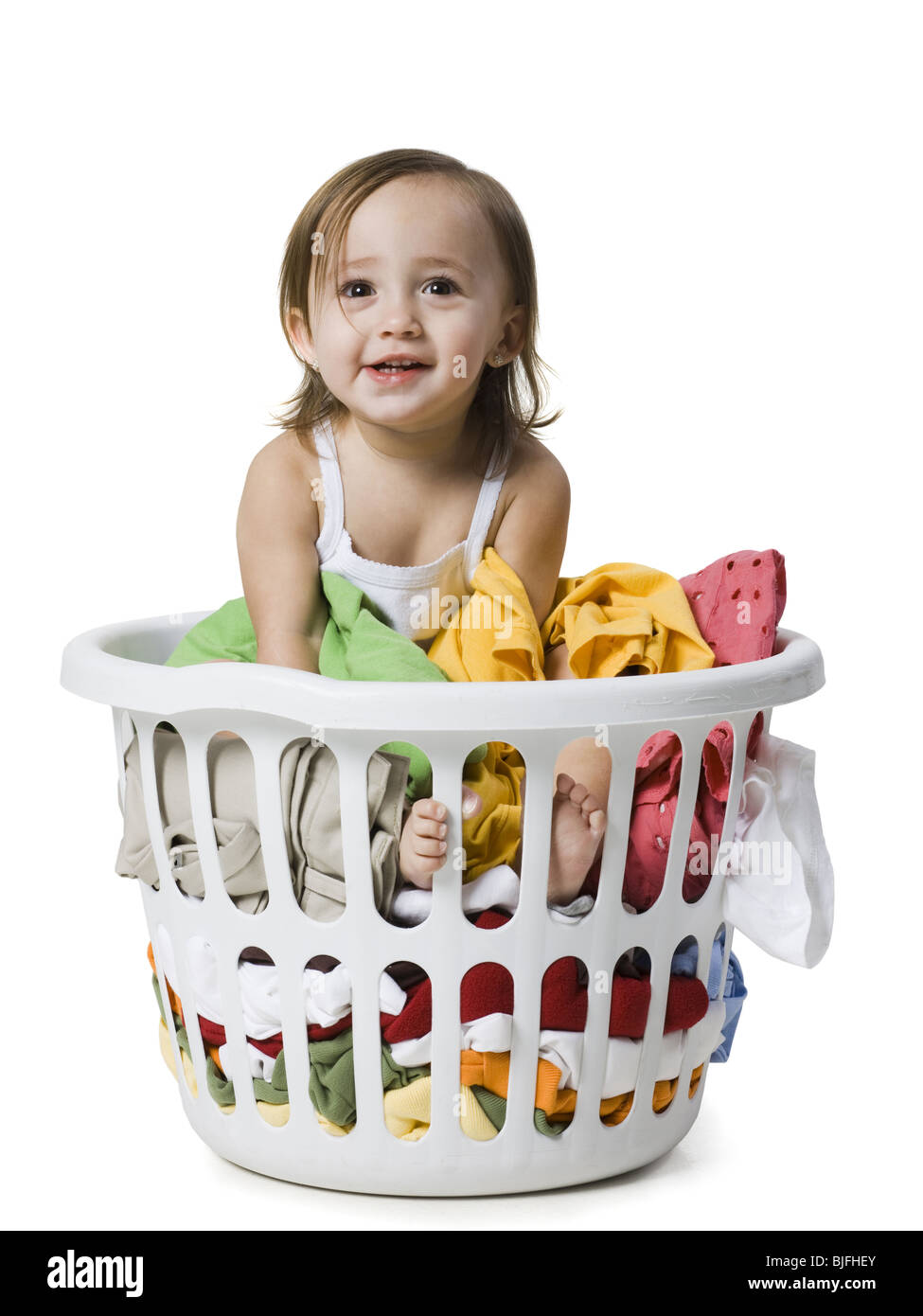baby girl in a laundry basket Stock Photo Alamy