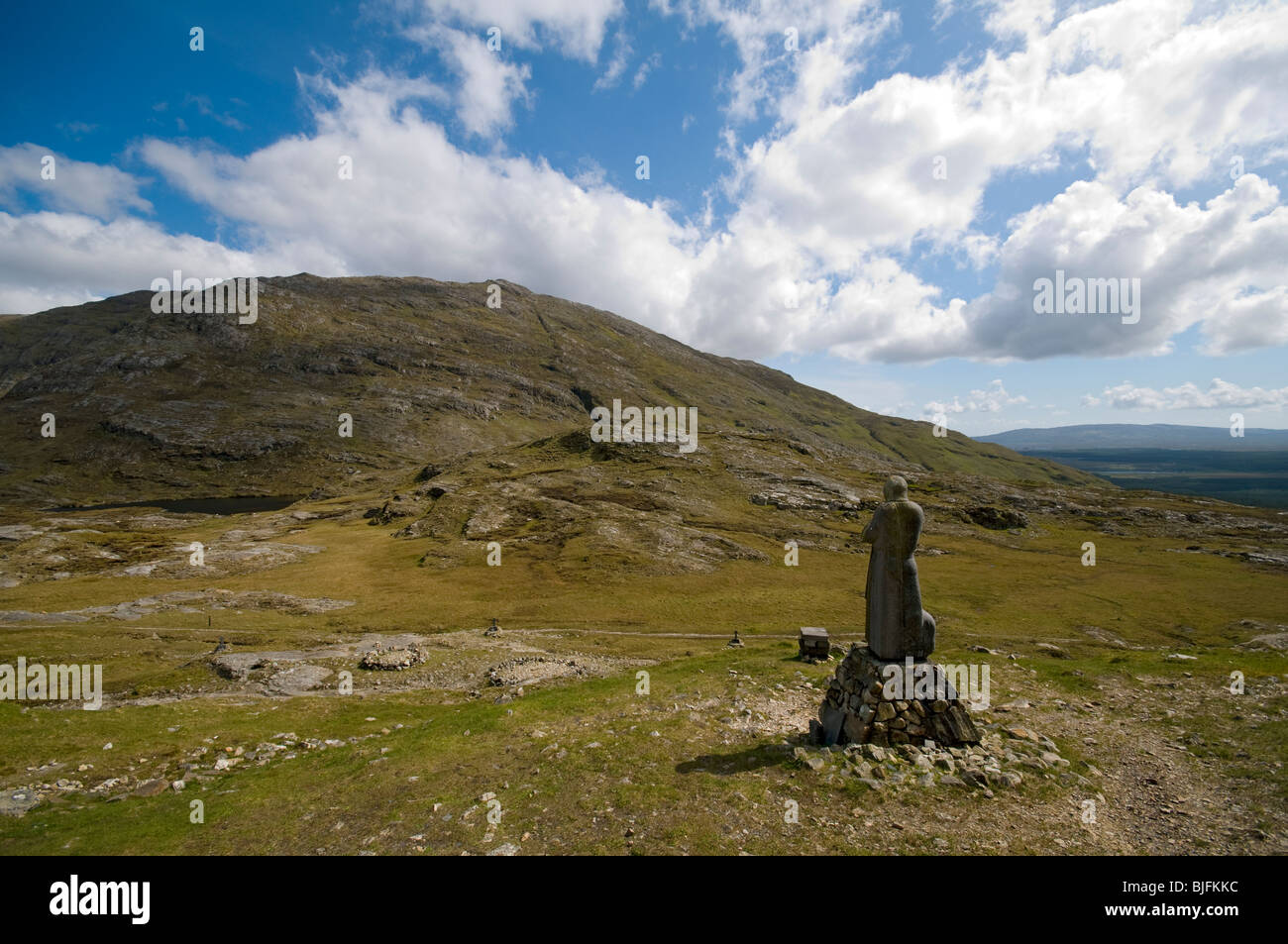 Statue of Saint Patrick at the summit of the Maumeen Pass, Maumturk Mountains, Connemara, County Galway, Ireland Stock Photo