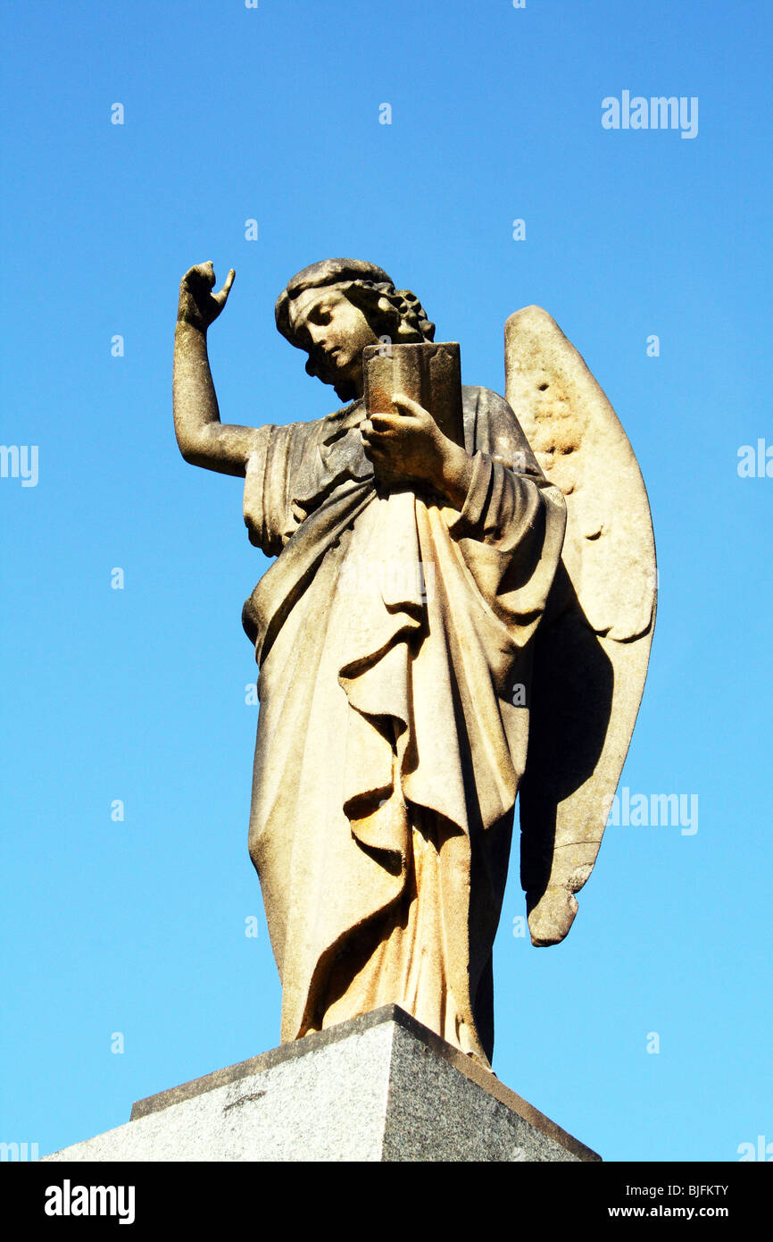 Stone angel pointing to heaven religous symbolism Stock Photo