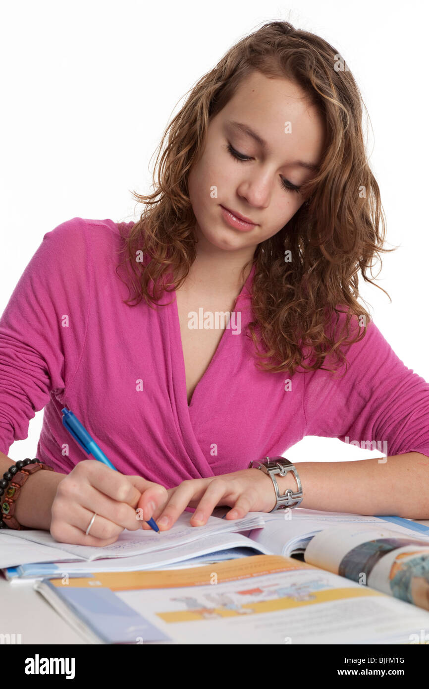 Teenage girl is making homework Stock Photo