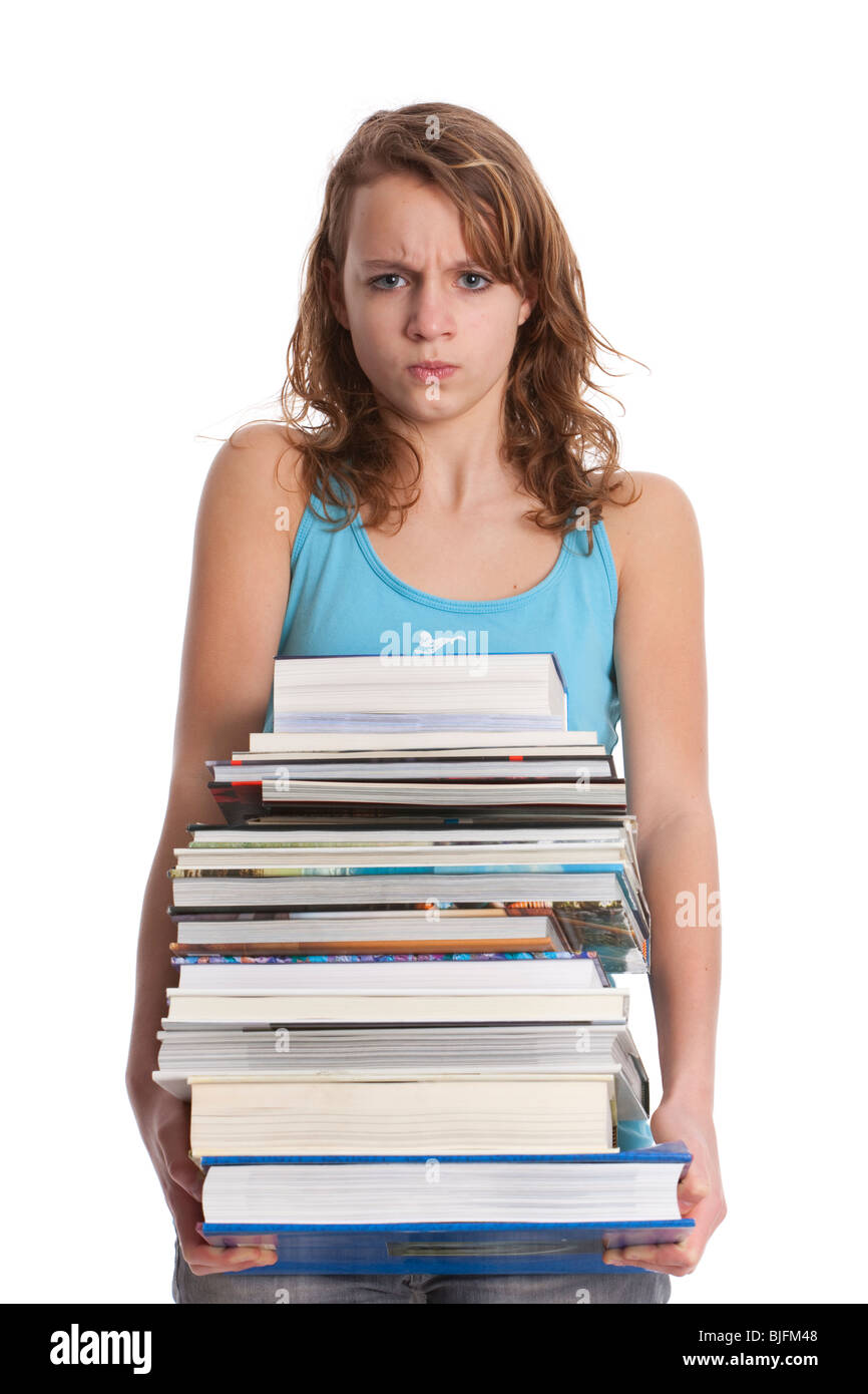 Teenage girl is carrying a pile of heavy books Stock Photo