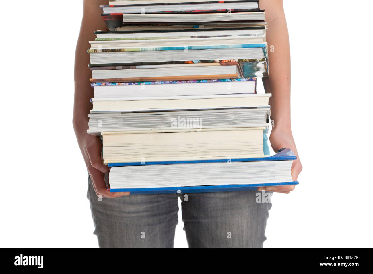 Carrying a pile of heavy books Stock Photo Alamy
