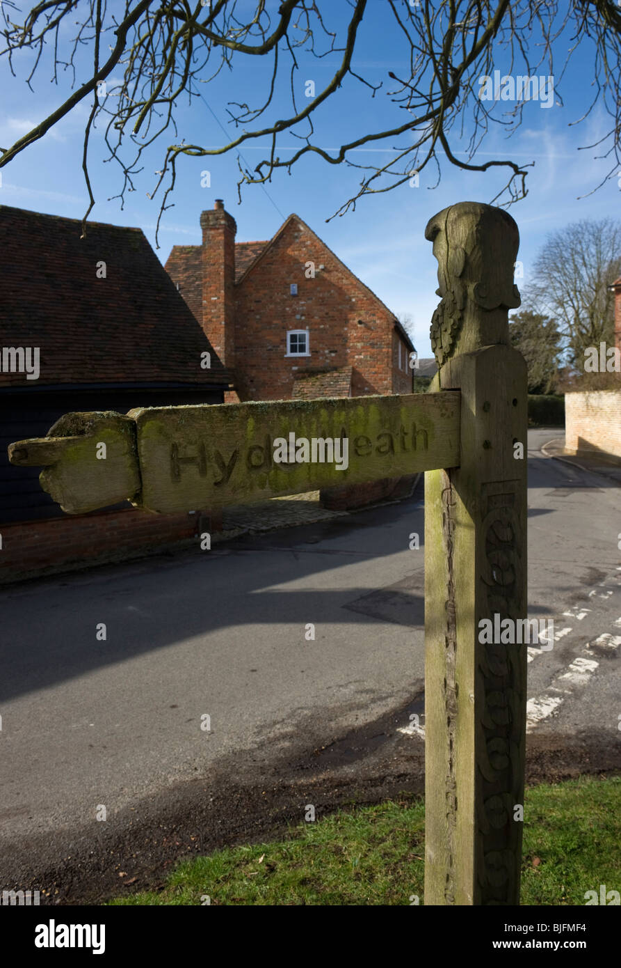 A street sign in the shape of an unusual carved wooden signpost in Little Missenden Buckinghamshire UK Stock Photo