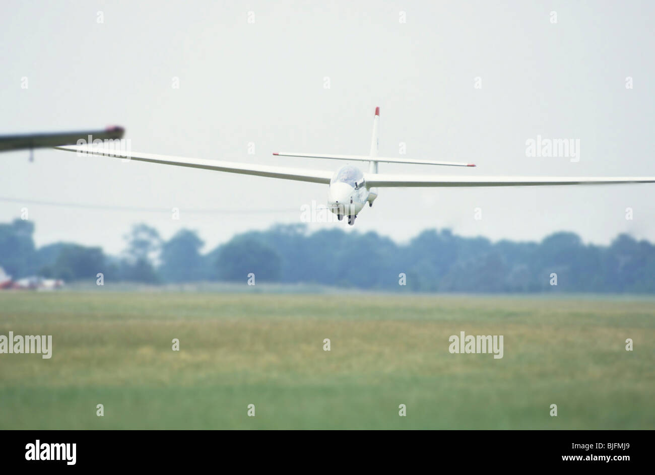 Glider landing in a field Stock Photo Alamy