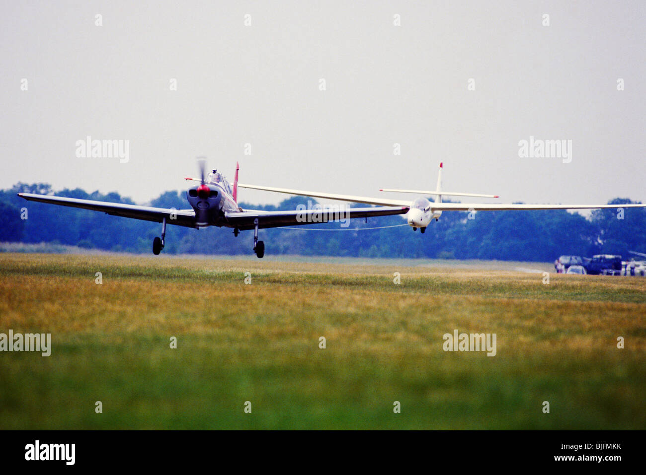 A small plane towing a glider Stock Photo Alamy