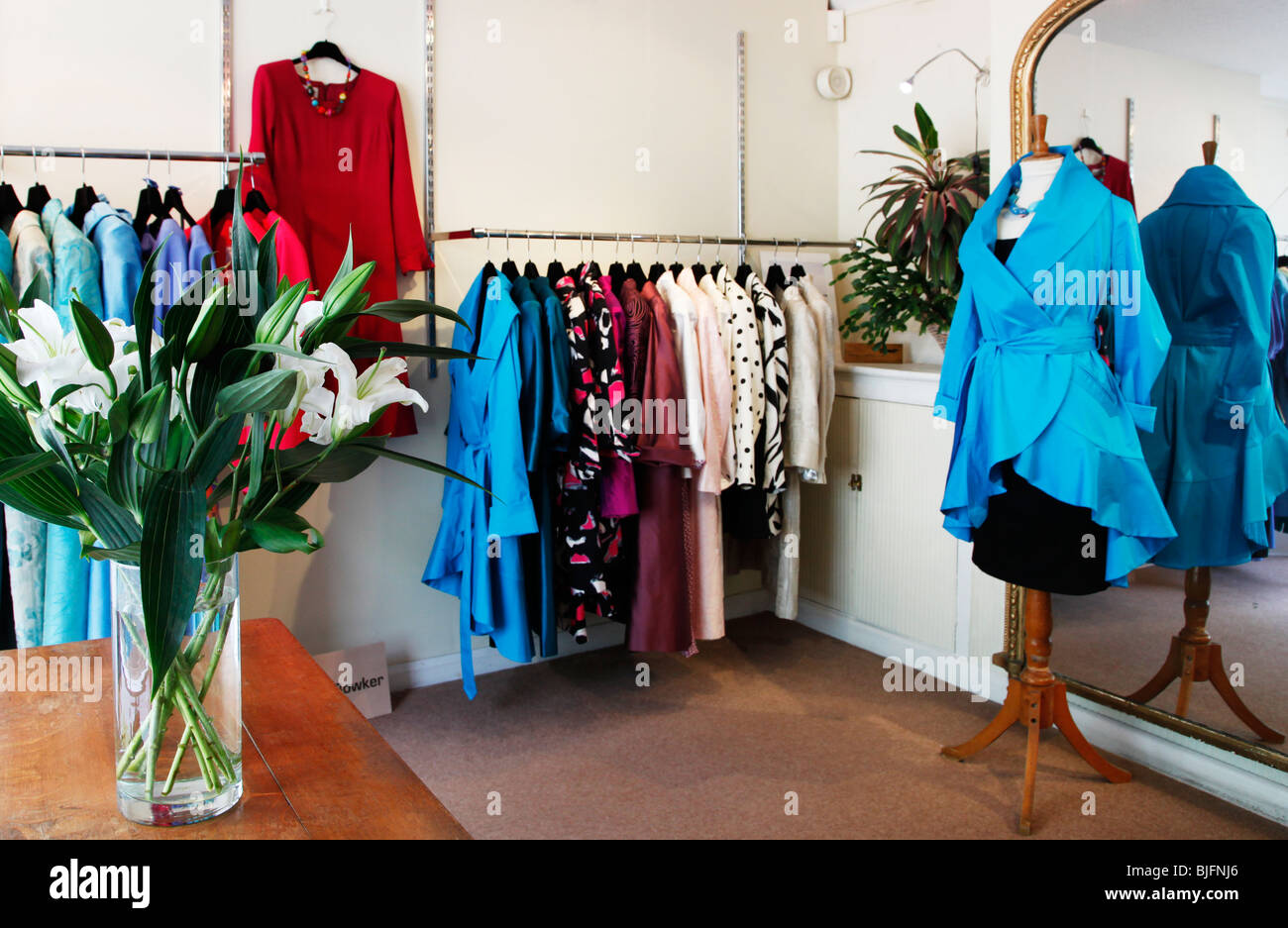 Interior of a ladies designer fashion store in England, UK Stock Photo -  Alamy