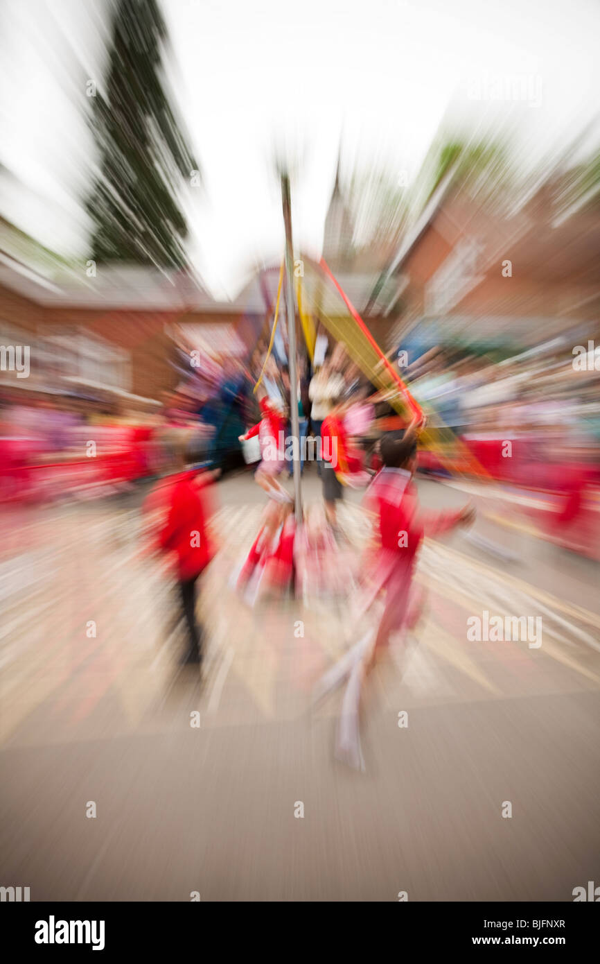School children dancing around the maypole in traditional May Day