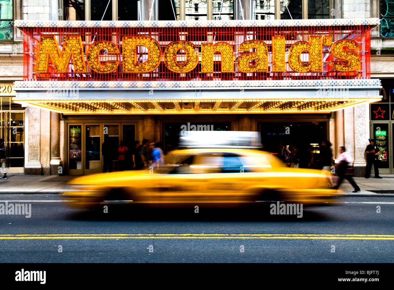 Yellow Cab passing MCDonald's Flagship restaurant - off Time Square New York City - Sept 2009 Stock Photo