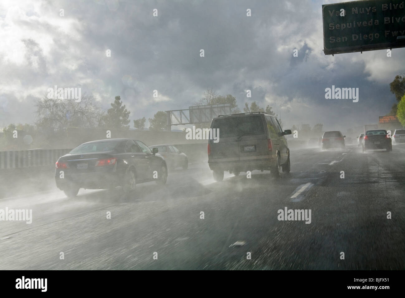 Cars driving in rainstorm on 101 Freeway. Los Angeles, California, USA Stock Photo