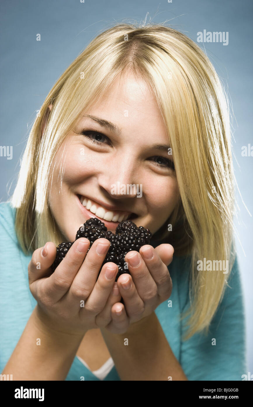 woman eating blackberries Stock Photo Alamy
