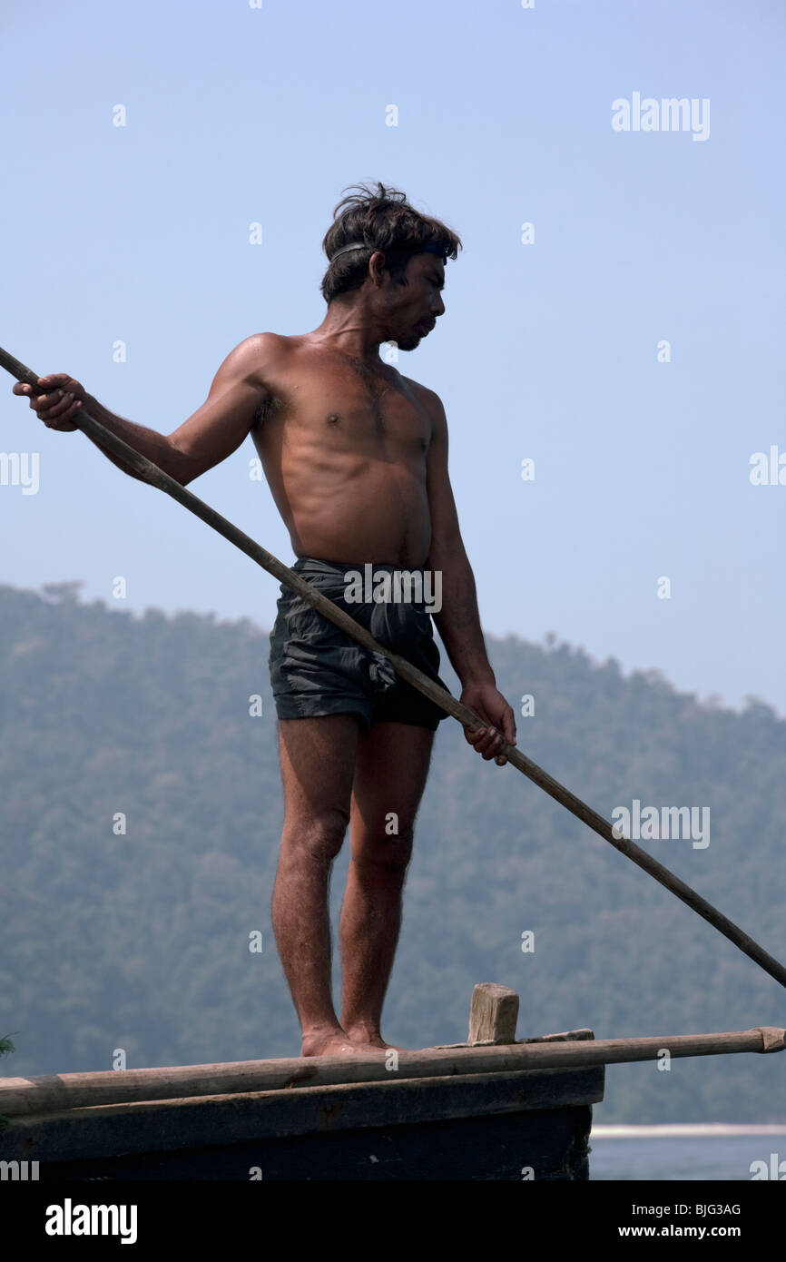 Myanmar sea-gypsies, the nomadic hunter-gatherers of South East Asia harpooning in the traditional way, from a boat prow. Stock Photo