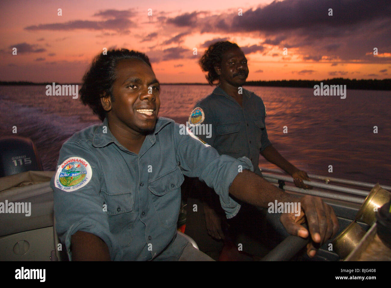 Aboriginal Rangers Brendan & Benjamin head out at sunset from Maningrida for a night catching and radio-tagging crocodile Stock Photo