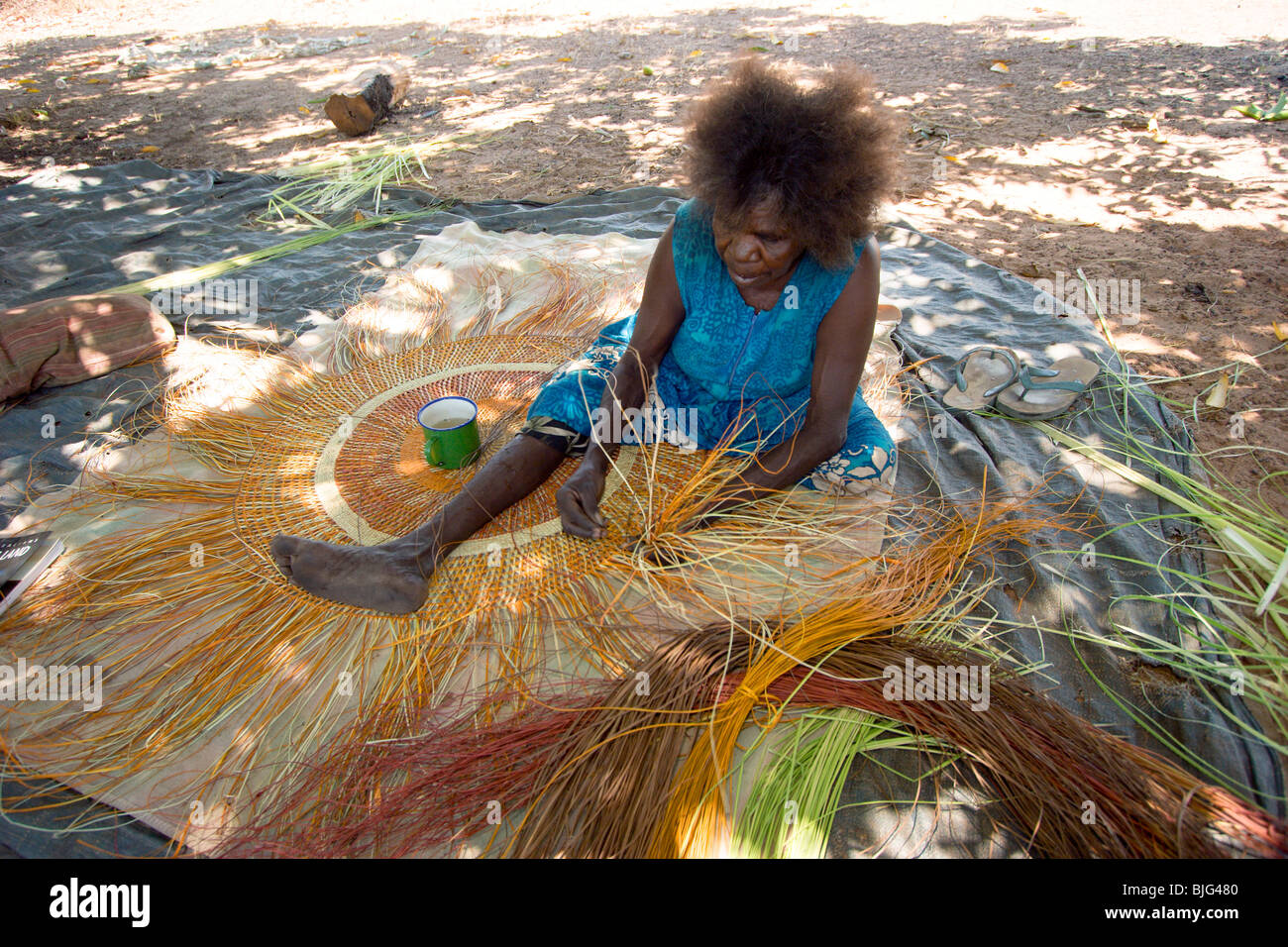 Aboriginal artist Judy Baypungnala a famous weaver making a pandanus