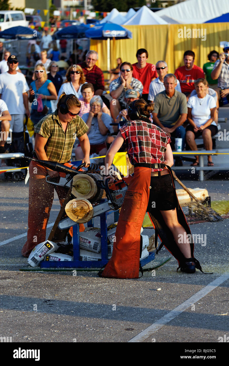 Female Lumberjacks using Chainsaws in Demonstration at the 2009 Kentucky State Fair in Louisville, Kentucky Stock Photo
