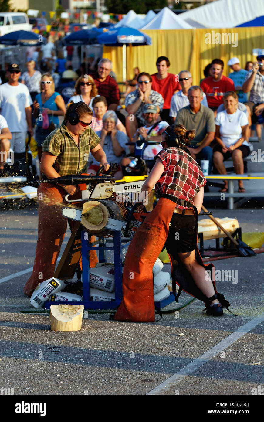 Female Lumberjacks using Chainsaws in Demonstration at the 2009 Kentucky State Fair in Louisville, Kentucky Stock Photo