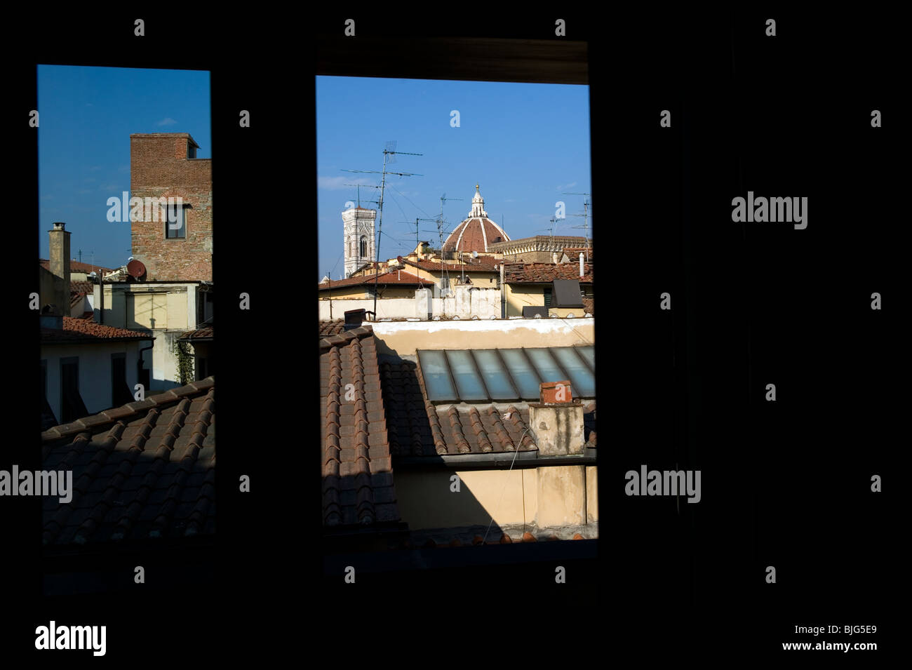 Room with a view. The Duomo, The Cathedral of St Mary of the Flower and the Bell tower by Giotto Stock Photo