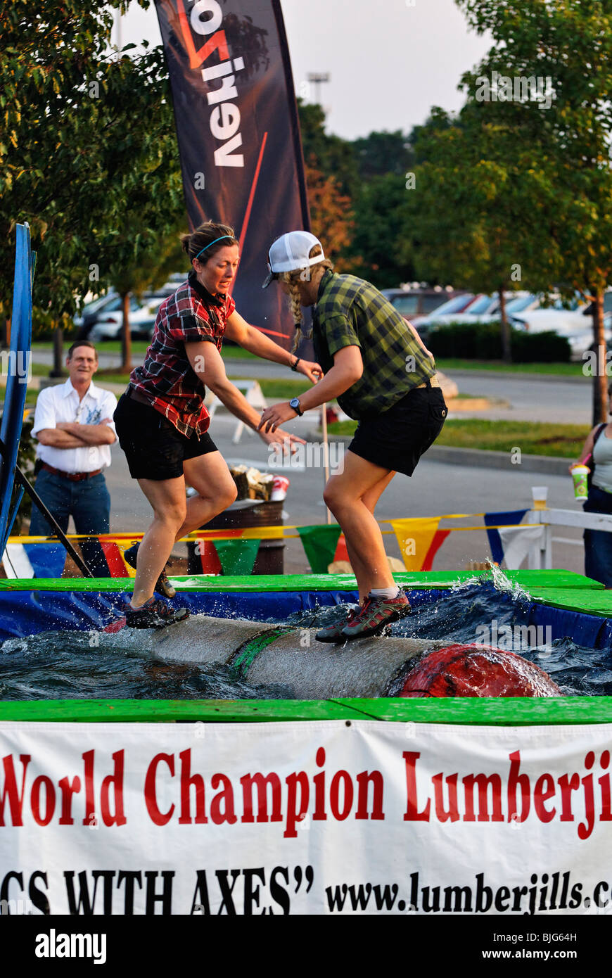 Female Lumberjacks Demonstrating Log Rolling at the 2009 Kentucky State Fair in Louisville, Kentucky Stock Photo