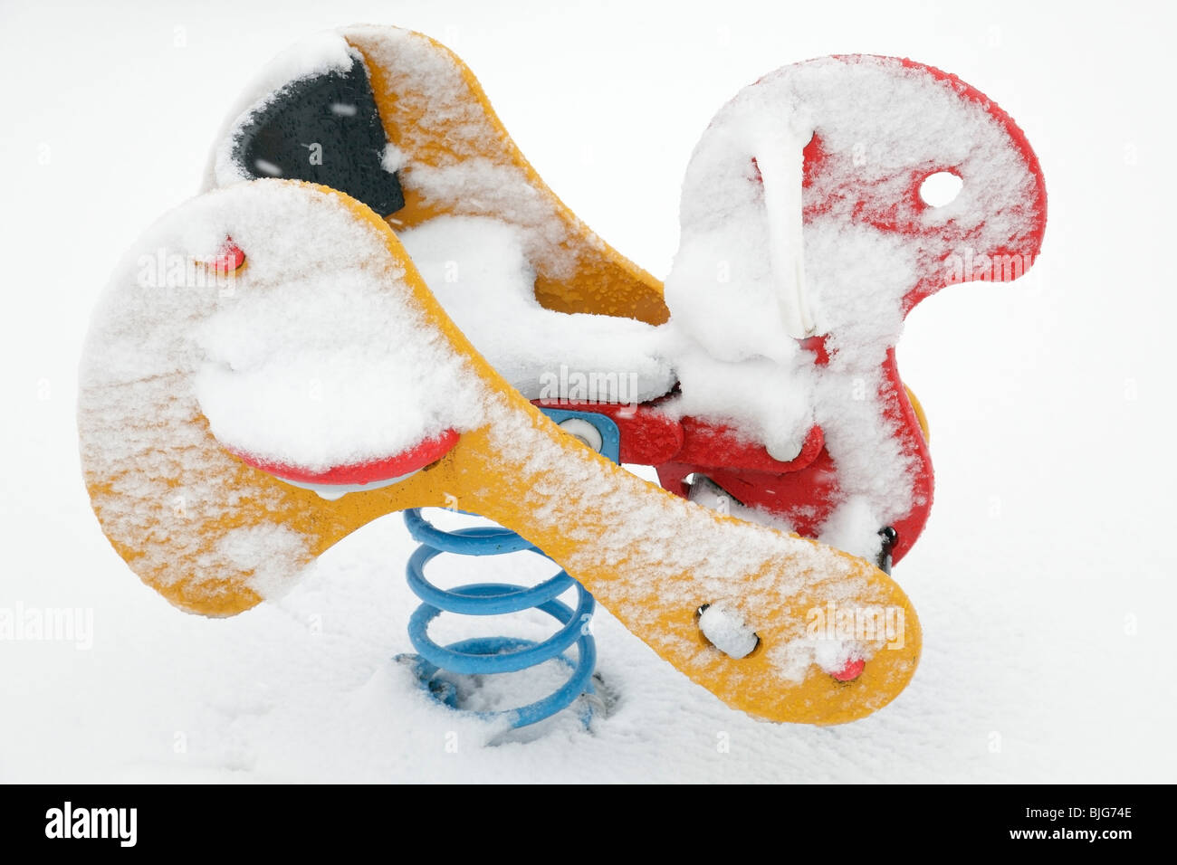 Children's playground in winter snow, Scotland, UK Stock Photo