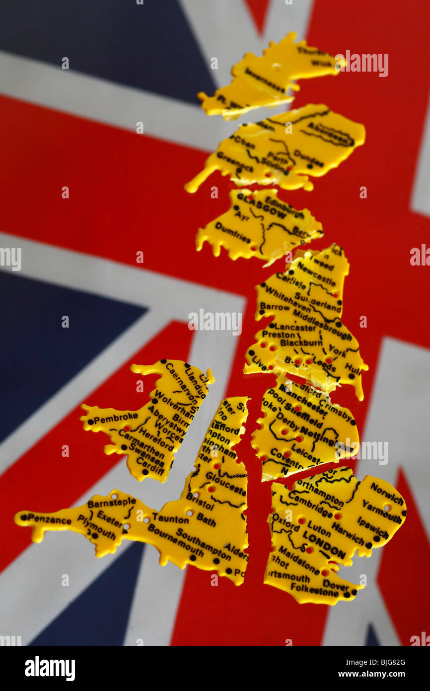 Broken Britain. A broken up plastic stencil of Britain against a background of the Union Jack flag. Stock Photo