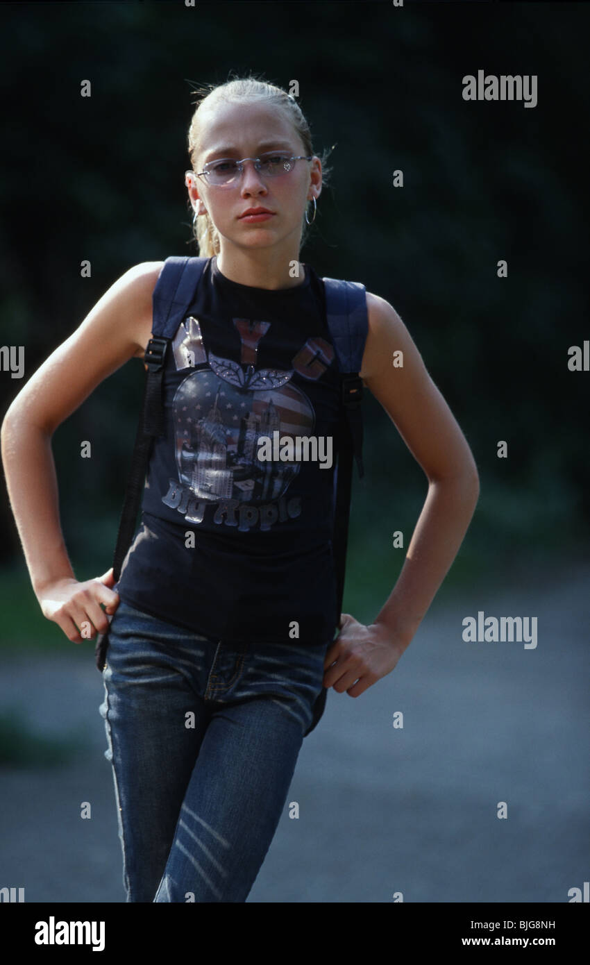 Preteen girl standing outside with  annoying attitude Stock Photo